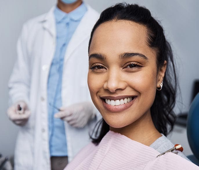 Portrait of a young woman having dental work done on her teeth.