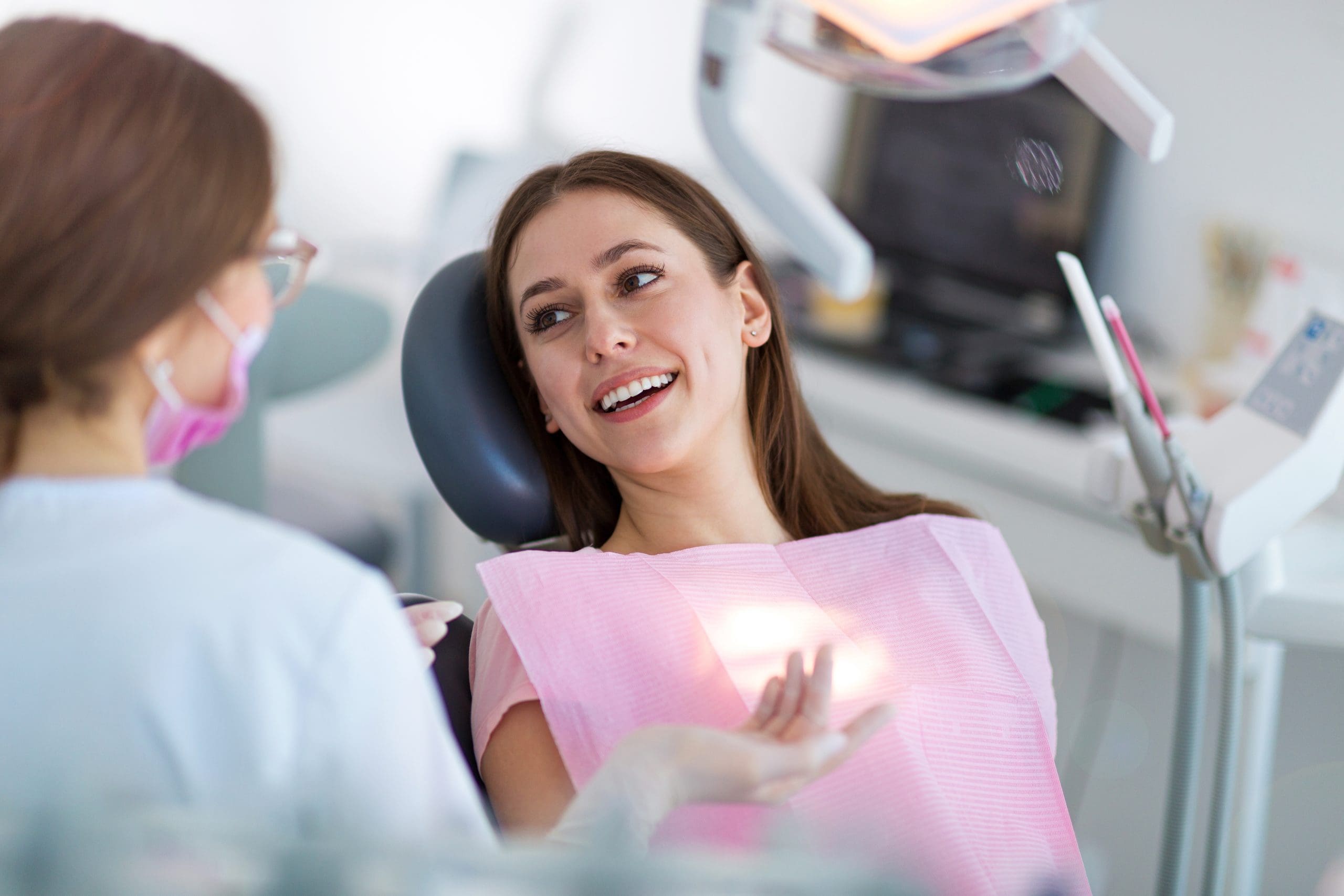 Female dental assistant and female patient in chair